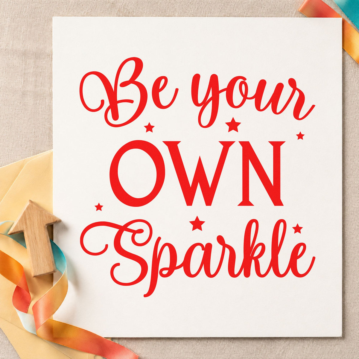 Be Your Own Sparkle rubber stamp shown in red ink, stamped for projects such as makeup tray labels.