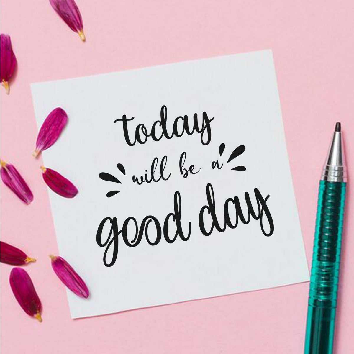 Custom stamp and seal design on white card with black today will be a good day lettering, pink background, purple petals, teal pen.