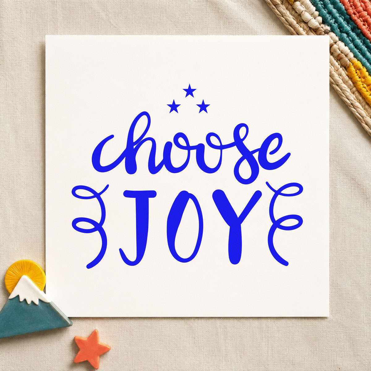 Choose Joy Stars Flourishes craft stamp in blue ink on cardstock, an easy option for book sleeve printing.
