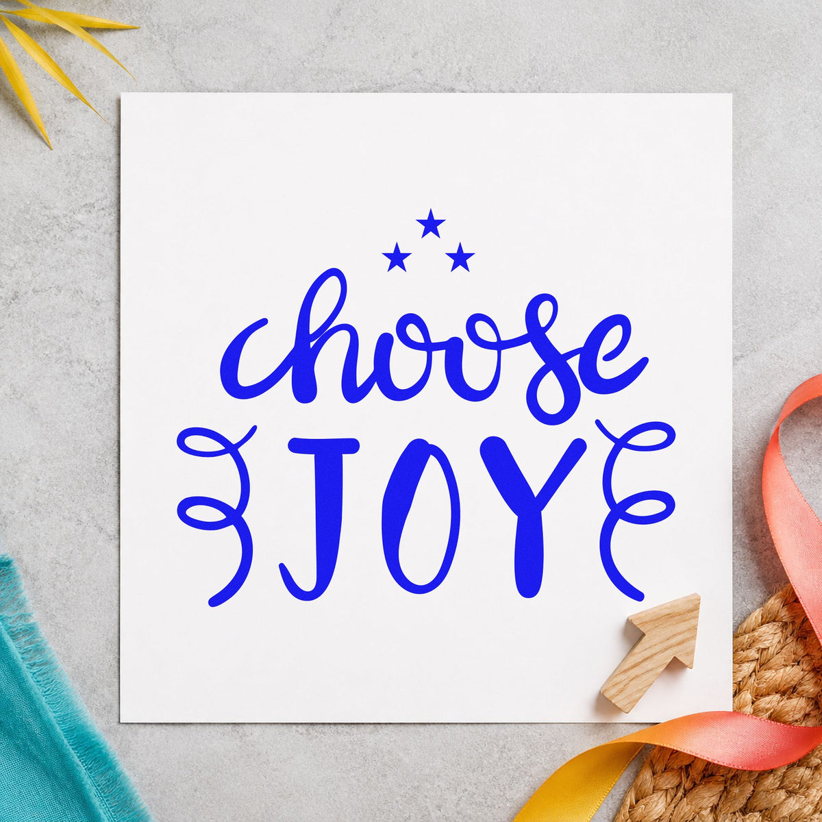 Choose Joy Stars Flourishes craft stamp imprinted in blue ink on paper, a design suited to framed writing nook.