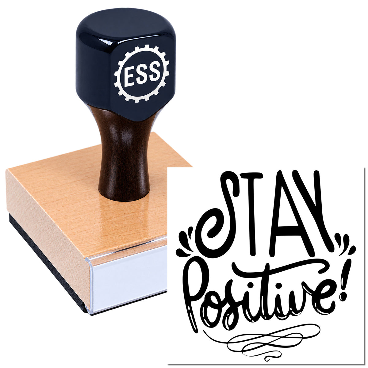 Dark navy ESS rubber stamp on a pink wooden block with black "Stay Positive" seal design
