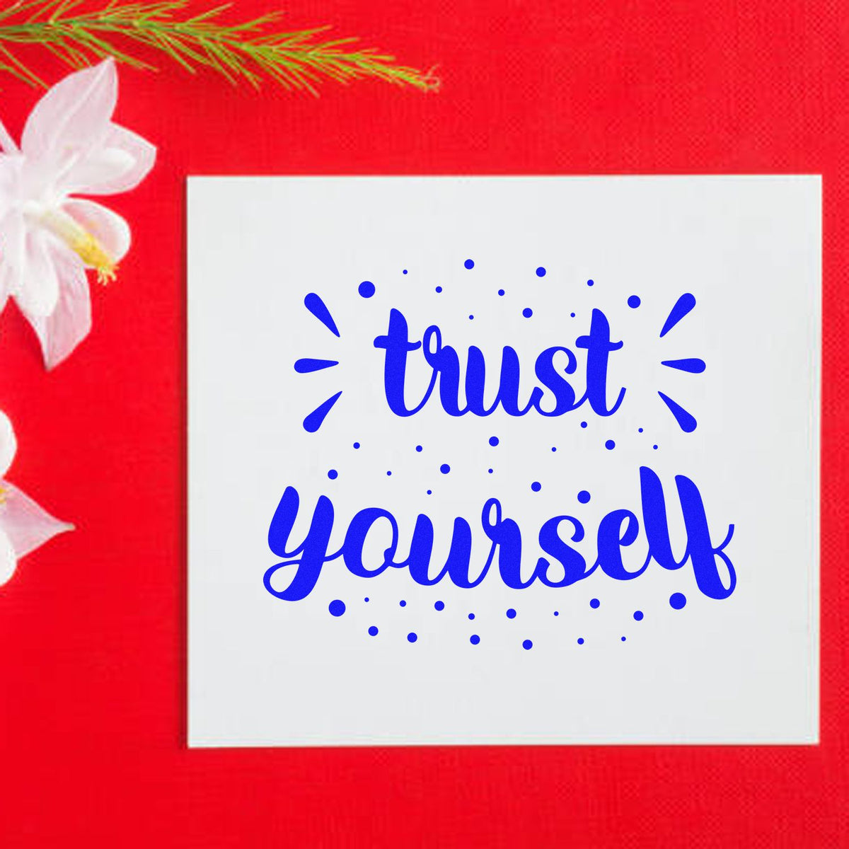 Blue trust yourself stamp/seal design on white square, set against a bright red background with white flower accents.