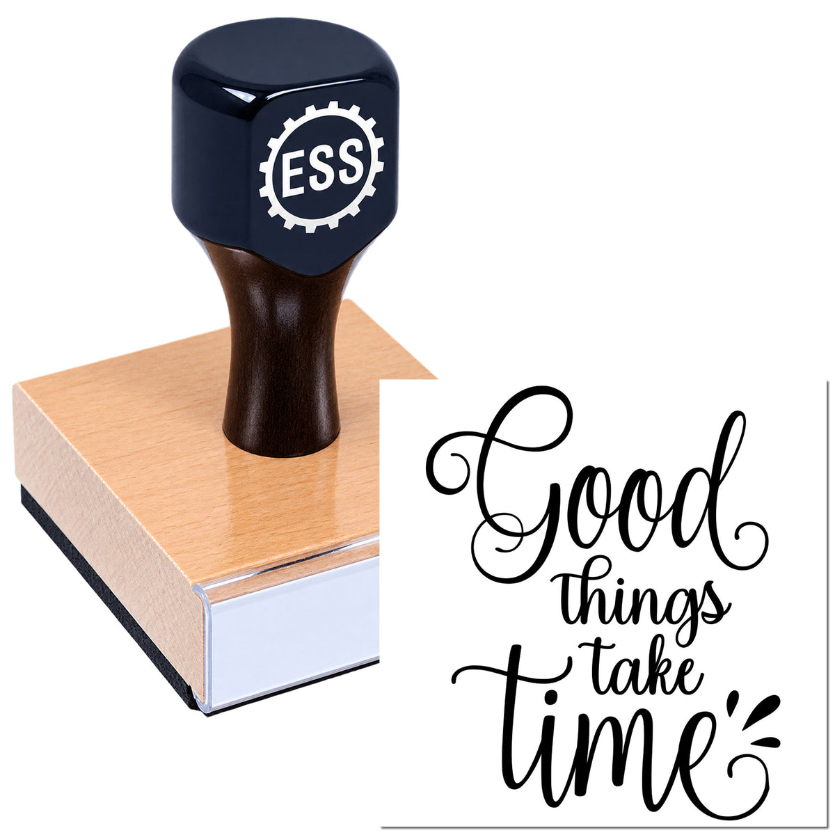 Black ESS seal stamp on a tan wooden block, with scripted "Good things take time" design.