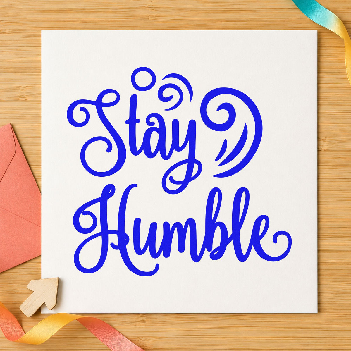Stay Humble Decorative Swirls craft stamp imprinted in blue ink on paper, a design suited to framed workshop beam.