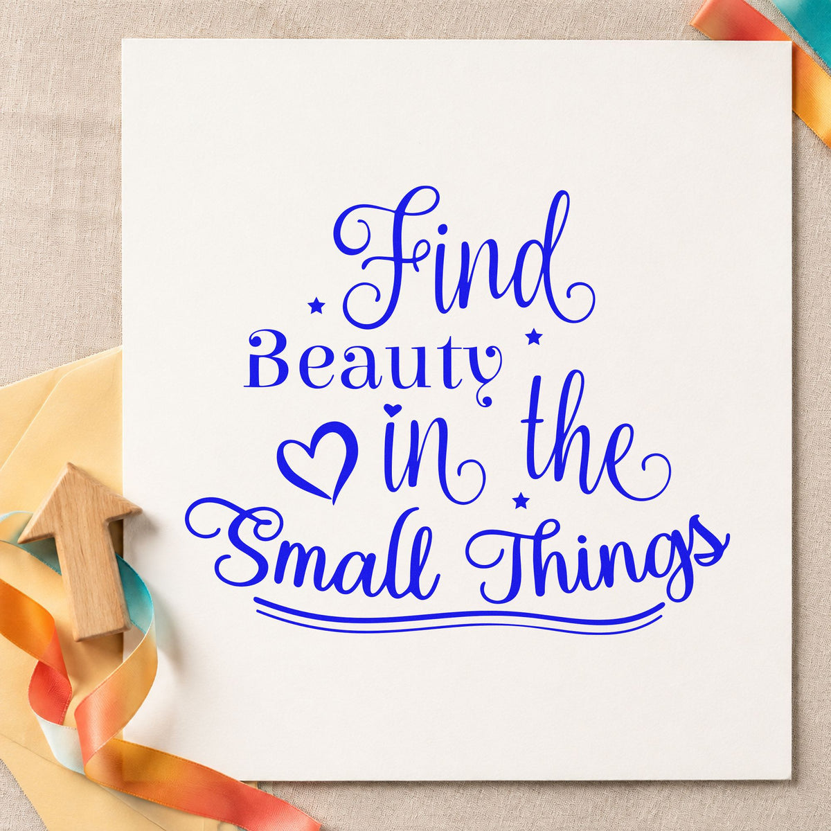 Find Beauty In Small Things craft stamp in blue ink on cardstock, an easy option for field bag printing.