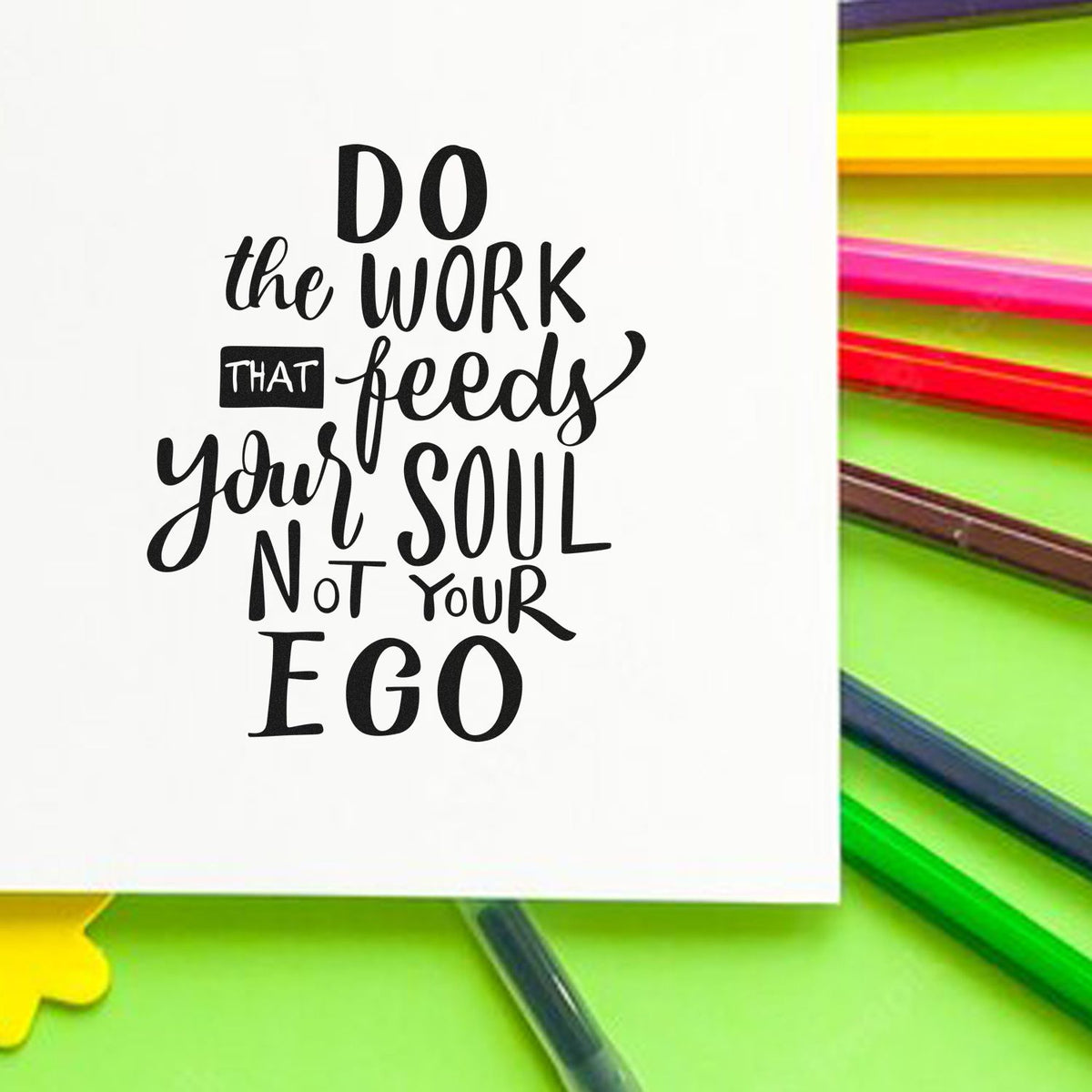 Black motivational stamp-and-seal design on white card, with neon green, pink, yellow, and blue stationery accents.