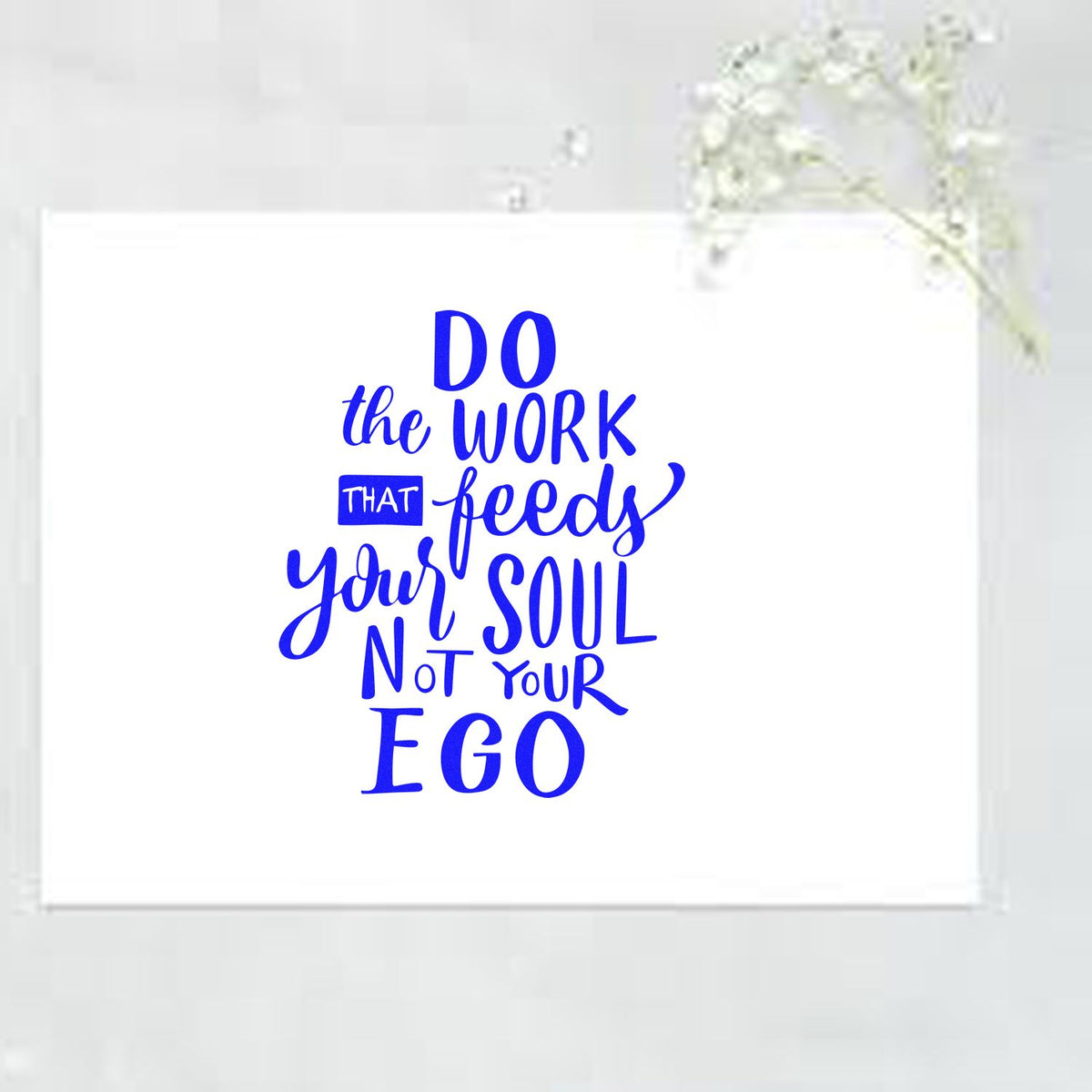 Blue stamp and seal design on white card reading Do the work that feeds your soul, not your ego.