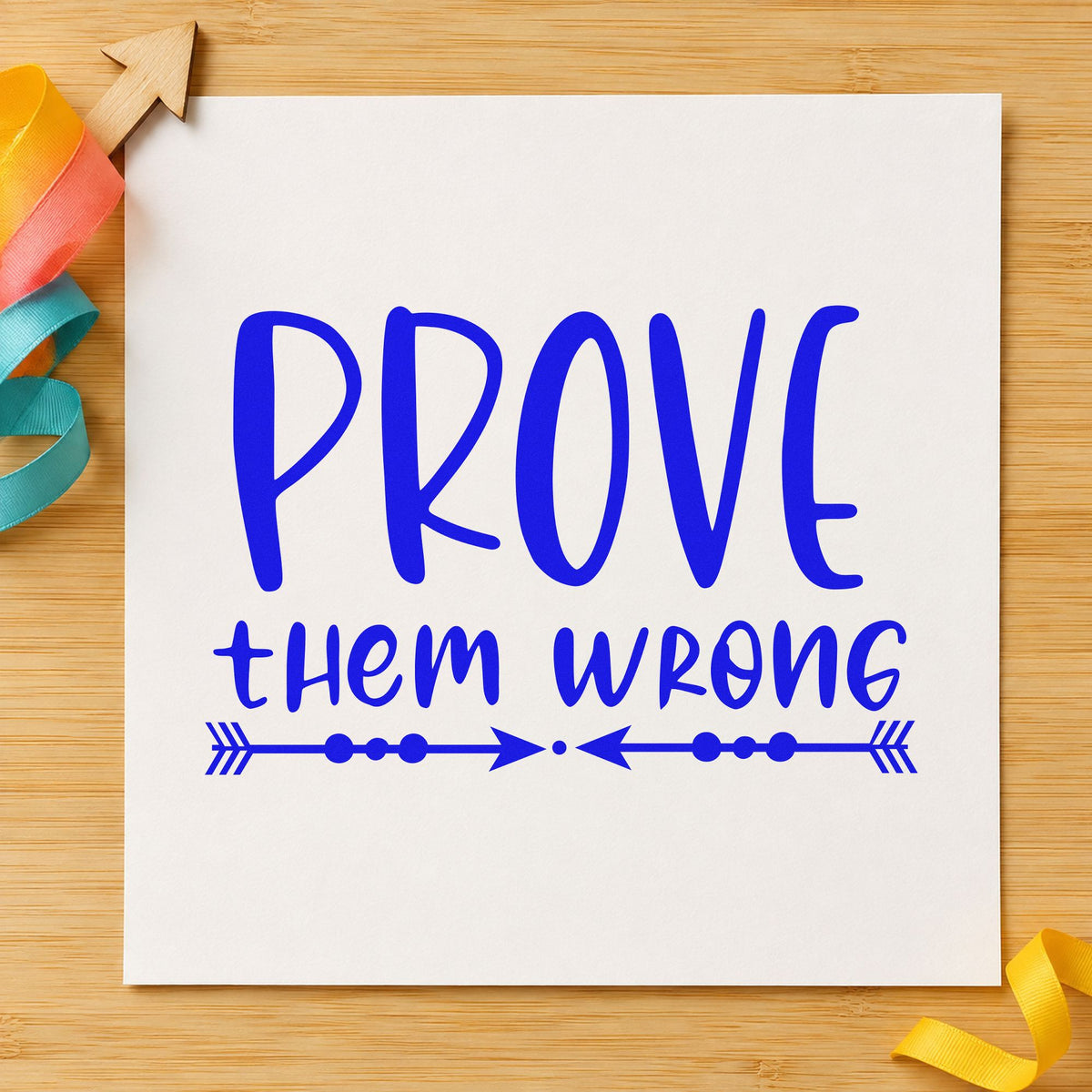 Prove Them Wrong Arrows craft stamp imprinted in blue ink on paper, a design suited to framed gym entry.
