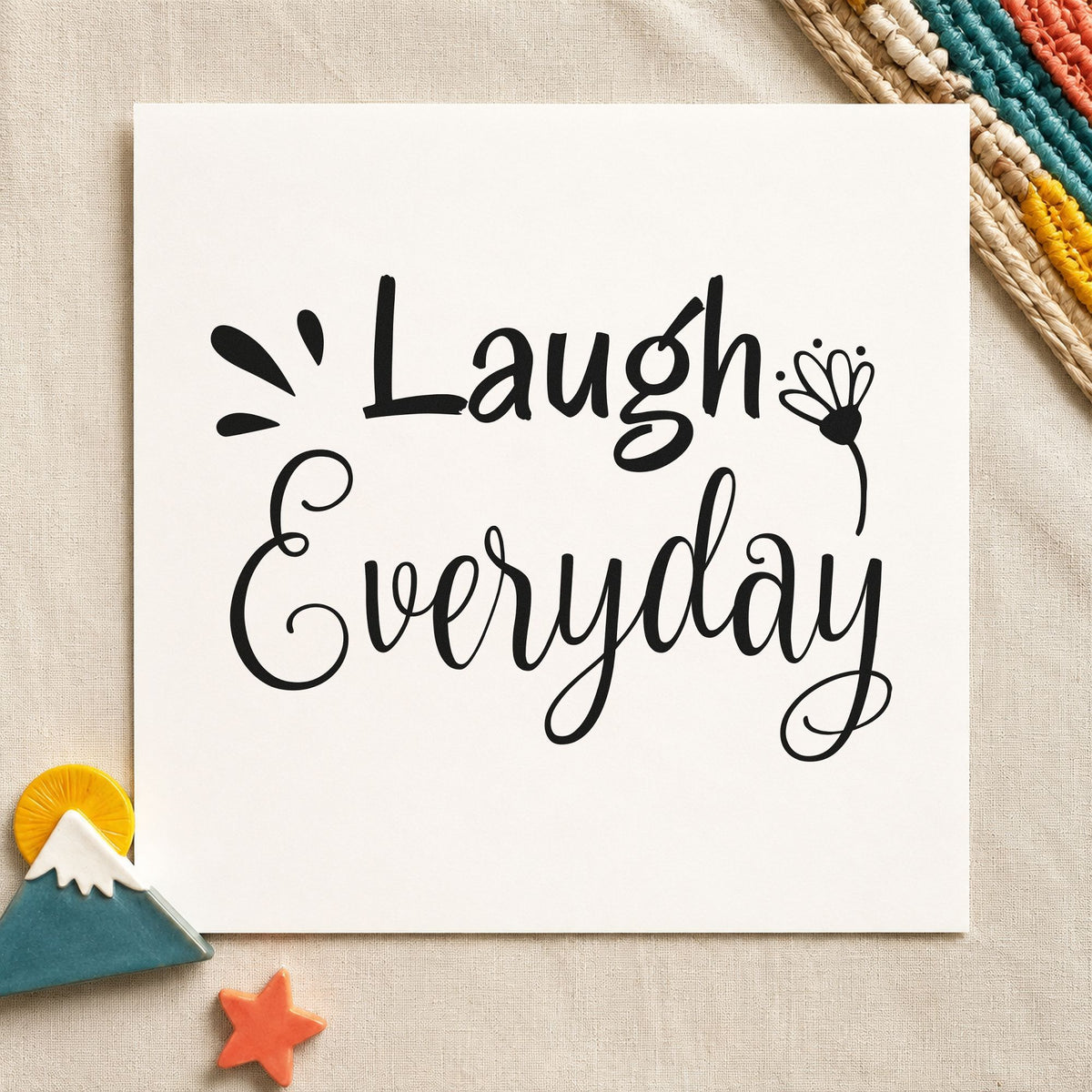 Laugh Every Day Flower craft stamp imprint in black ink on a handmade project, one idea being joke jar gift tags.