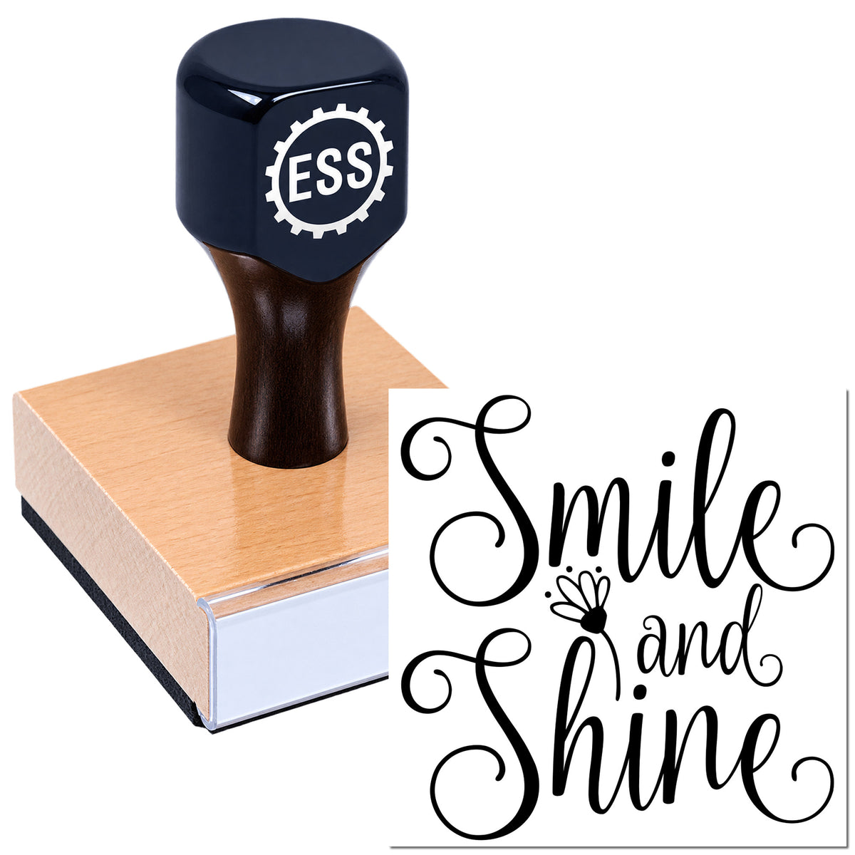 Dark navy rubber stamp with ESS logo on a peach wooden block beside a black "Smile and Shine" script seal design.