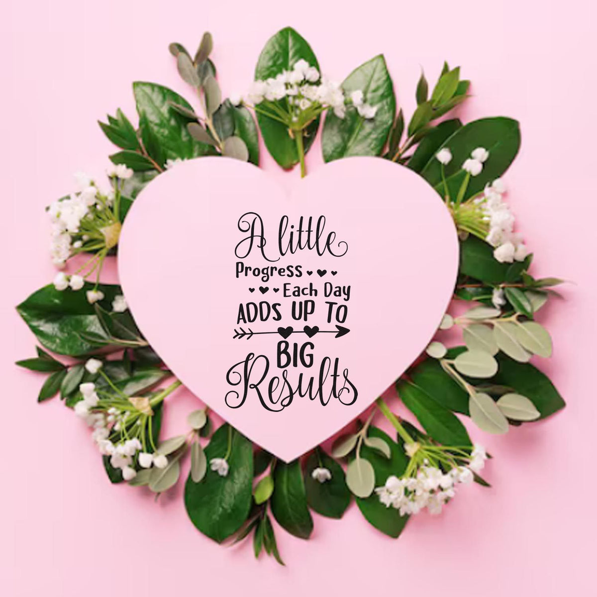 Pink heart-shaped stamp seal with black motivational text, framed by green leaves and white flowers.