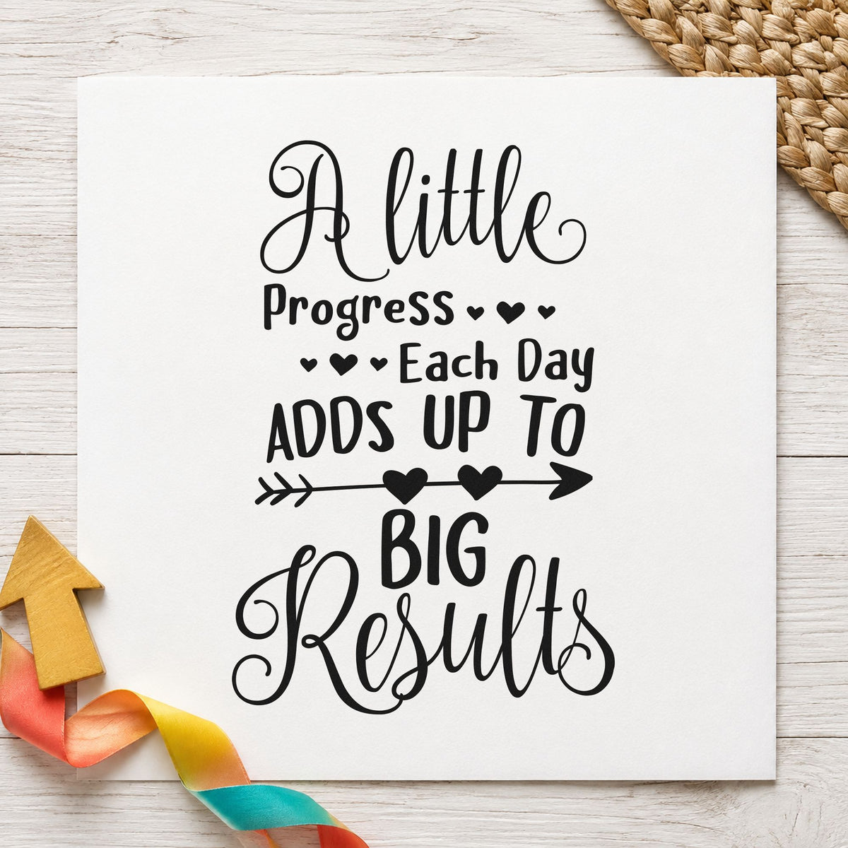 Little Progress Big Results craft stamp imprint in black ink on a handmade project, one idea being tracker gift tags.