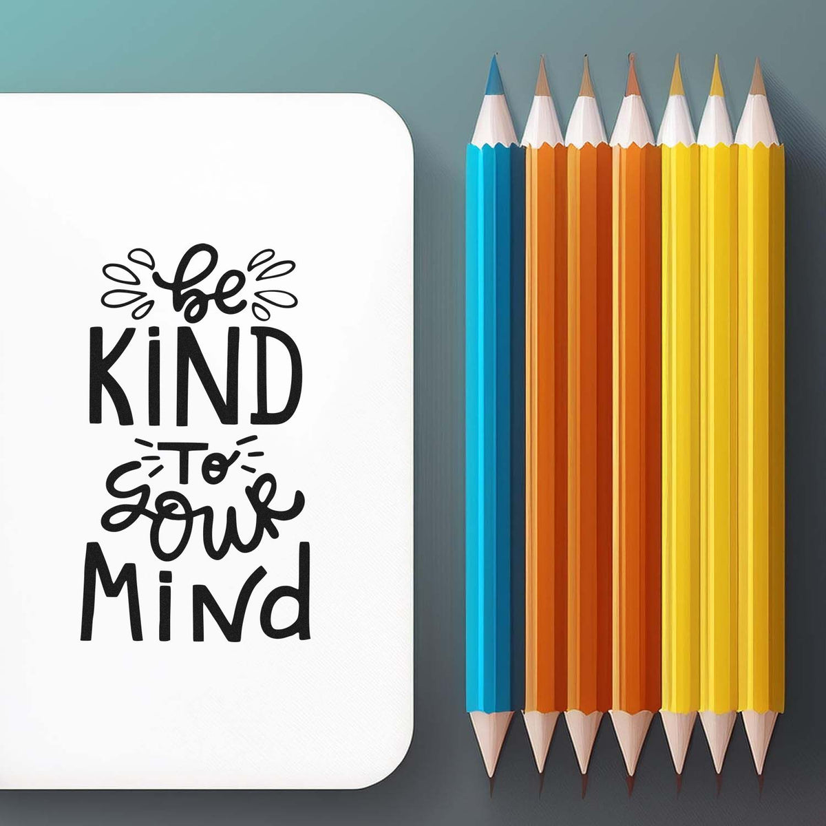Be Kind to Your Mind stamp and seal design in black on white, beside blue, orange and yellow pencils.