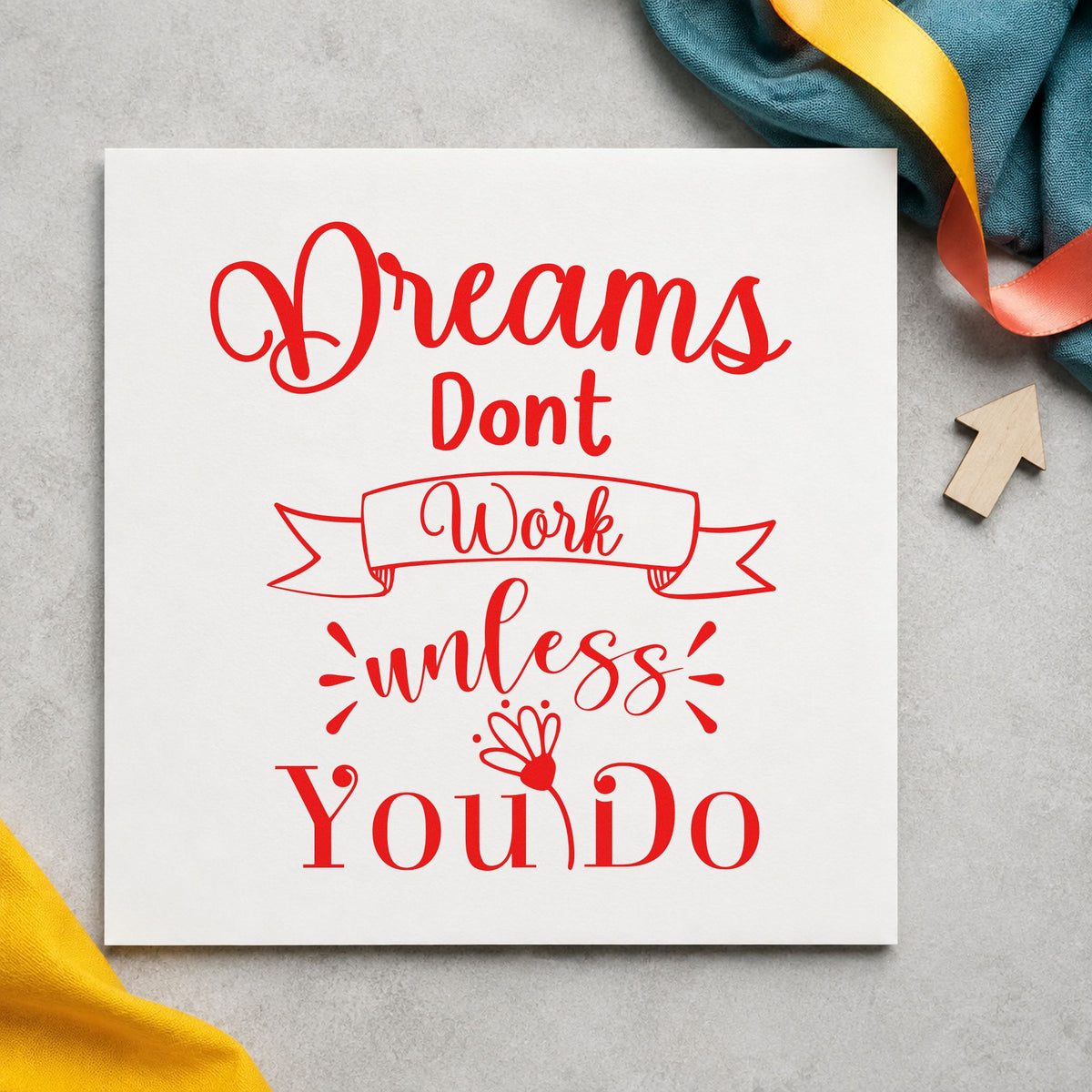 Dreams Don't Work Unless You Do rubber stamp shown in red ink, stamped for projects such as shelf stock labels.