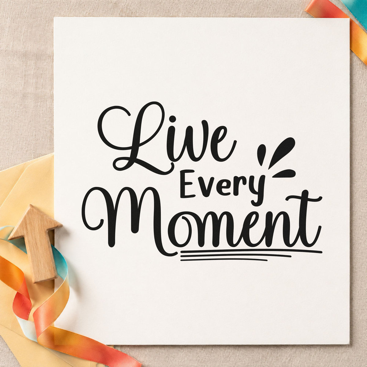 Live Every Moment Lettering craft stamp imprint in black ink on a handmade project, one idea being party gift tags.