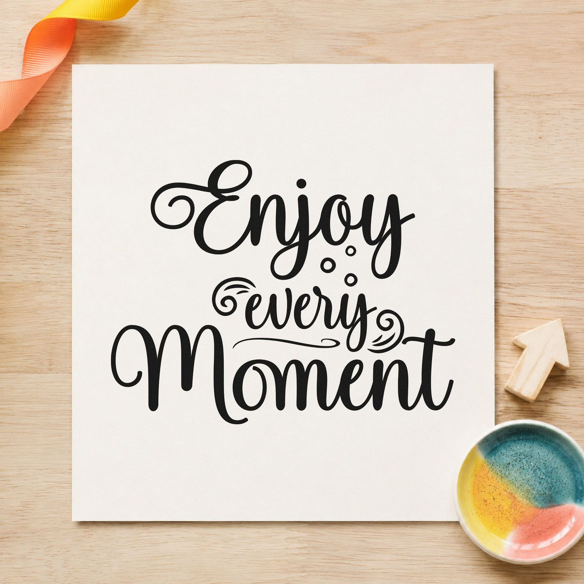 Enjoy Every Moment Flourishes craft stamp imprint in black ink on a handmade project, one idea being favor box gift tags.