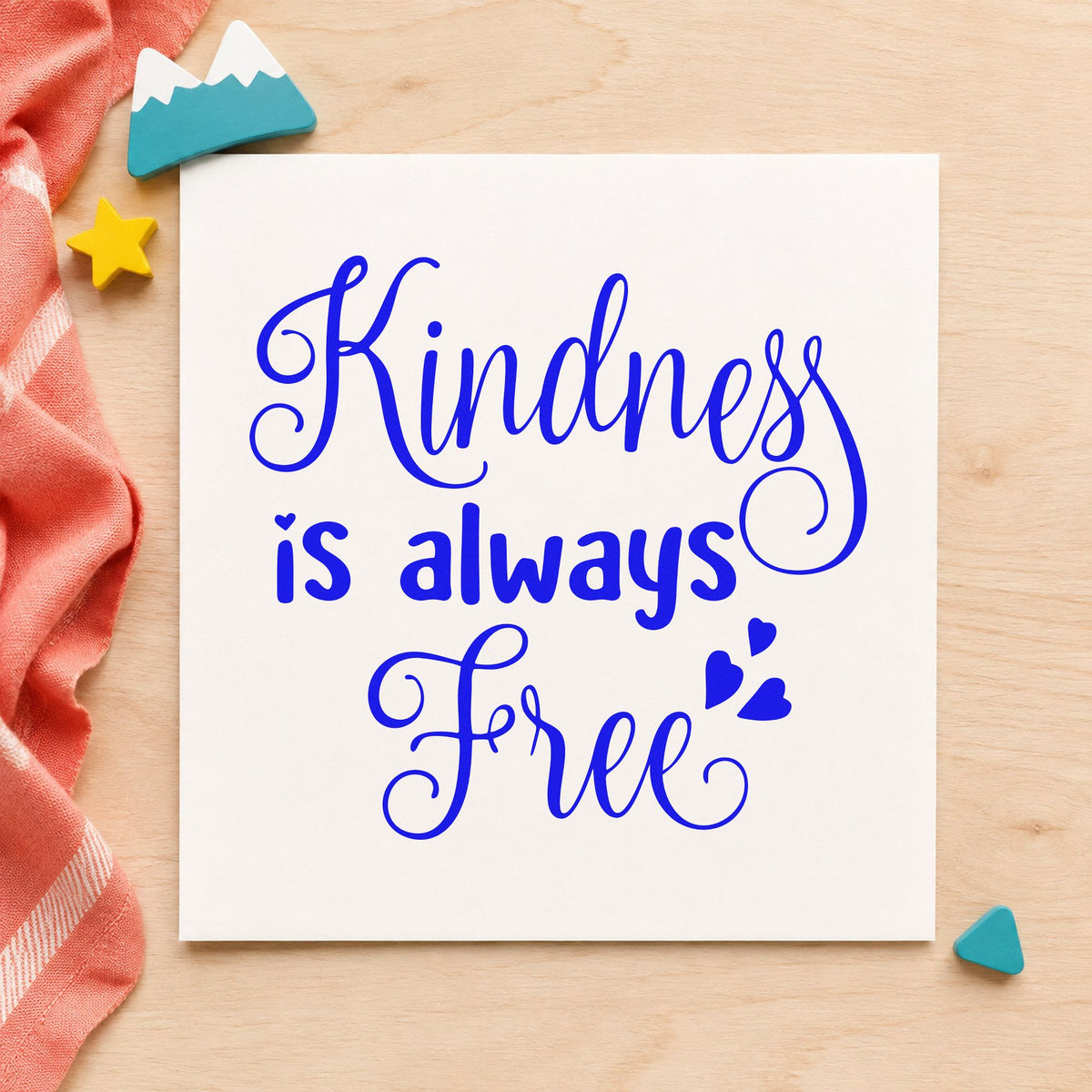 Kindness Is Always Free craft stamp in blue ink on cardstock, an easy option for volunteer vest printing.