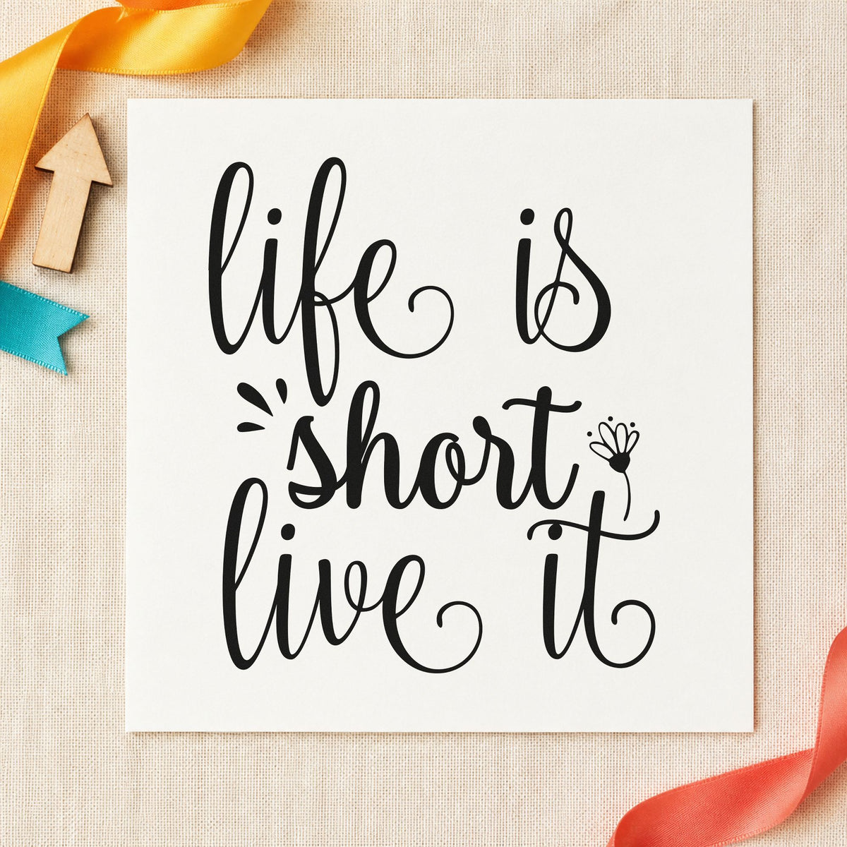 Life Is Short Live It craft stamp imprint in black ink on a handmade project, one idea being saddle bag gift tags.