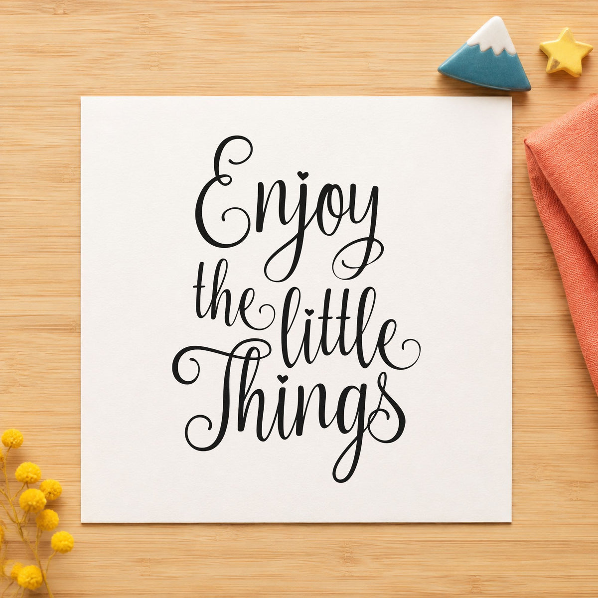 Enjoy The Little Things craft stamp imprint in black ink on a handmade project, one idea being tea tin gift tags.