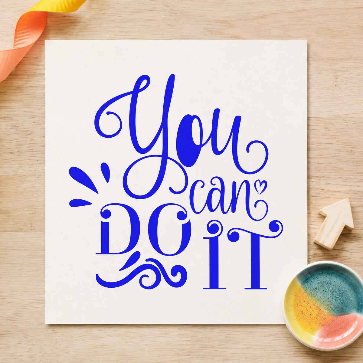 You Can Do It Flourishes craft stamp imprinted in blue ink on paper, a design suited to framed bathroom shelf.
