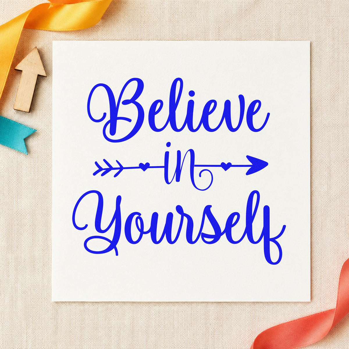 Believe In Yourself Arrow craft stamp in blue ink on cardstock, an easy option for warmup wrap printing.