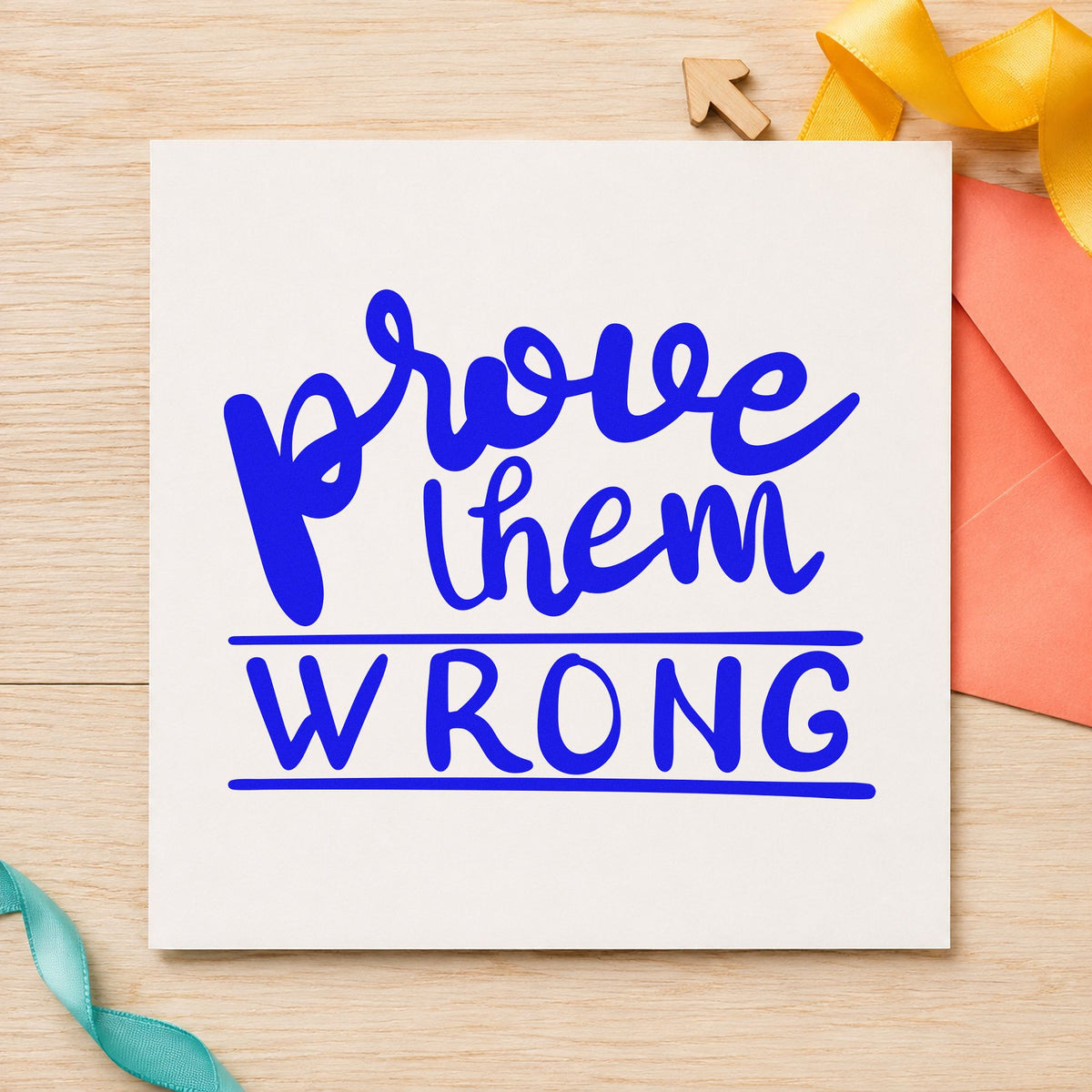 Prove Them Wrong Bold craft stamp in blue ink on cardstock, an easy option for portfolio case printing.