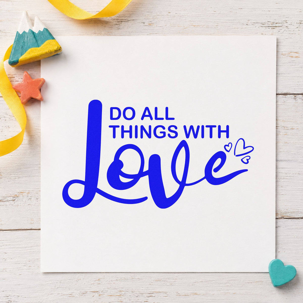 Do All Things With Love craft stamp in blue ink on cardstock, an easy option for quilt label printing.