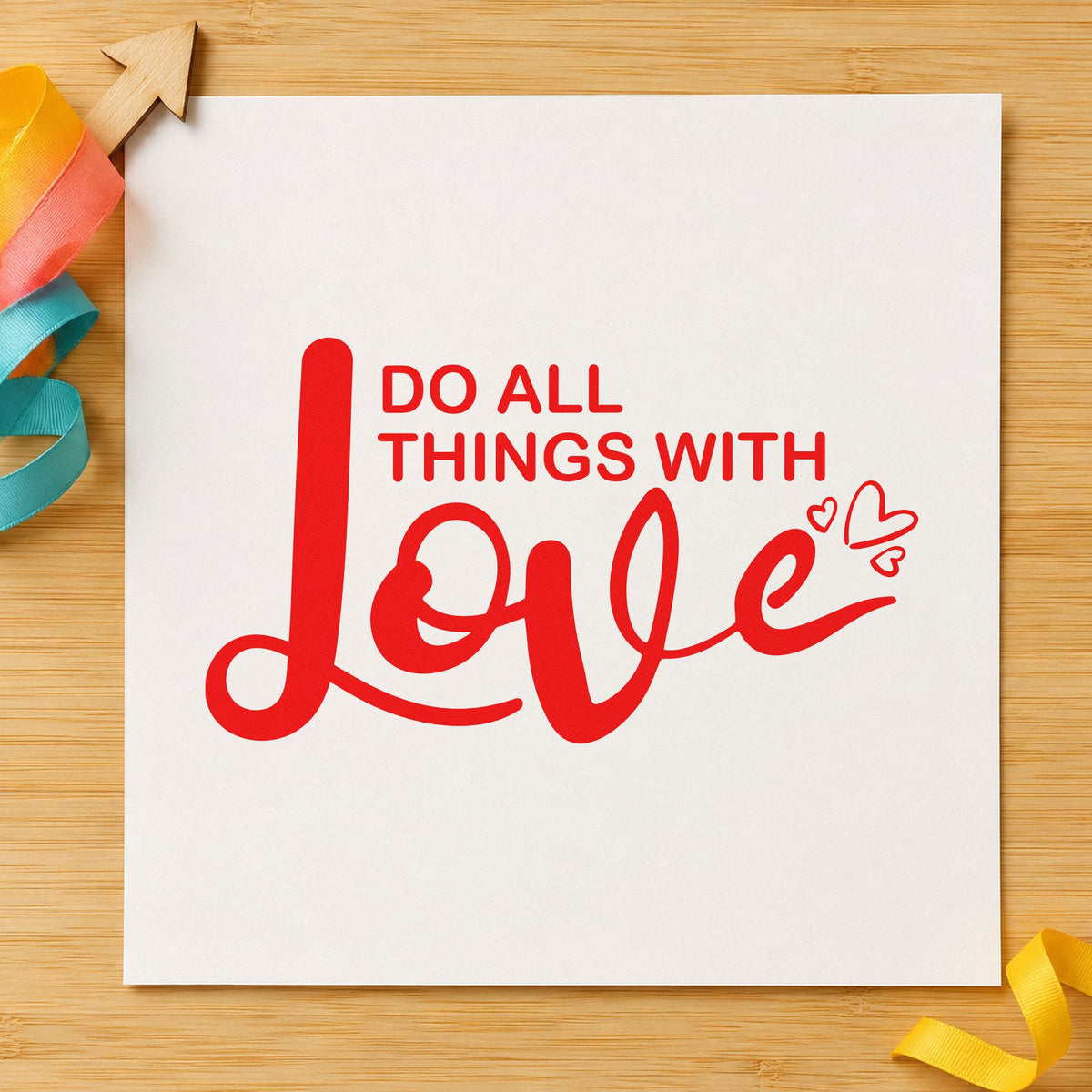 Do All Things With Love craft stamp imprint in red ink on a handmade project, one idea being care note cards.