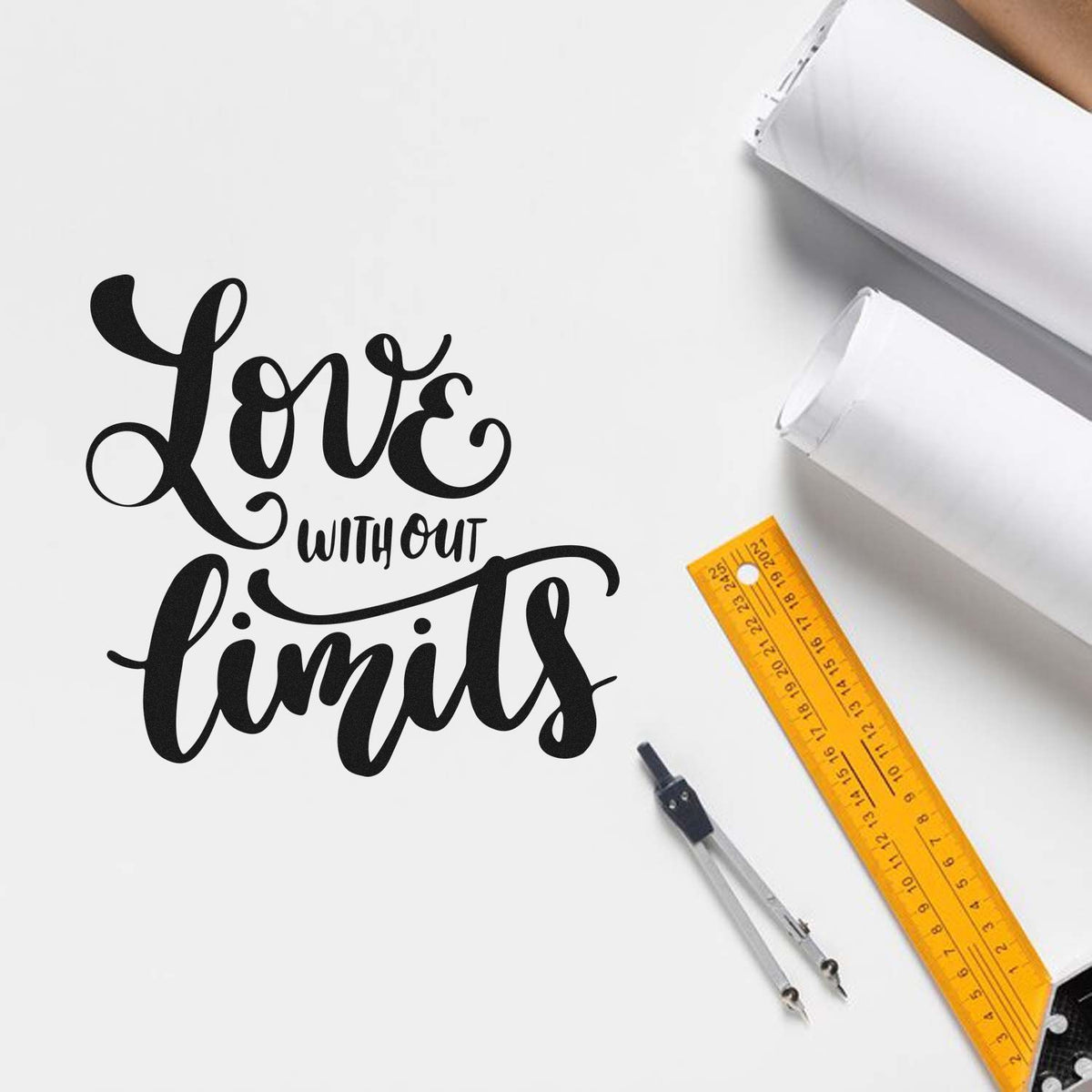 Black Love without limits stamp and seal design with yellow ruler, compass, and white drafting tools on a white background.