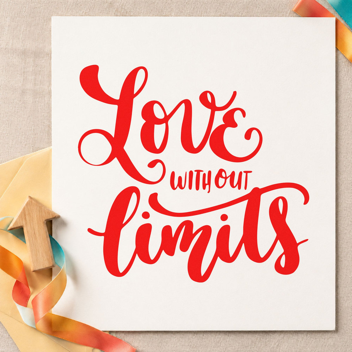 Love Without Limits Script craft stamp imprint in red ink on a handmade project, one idea being first week cards.