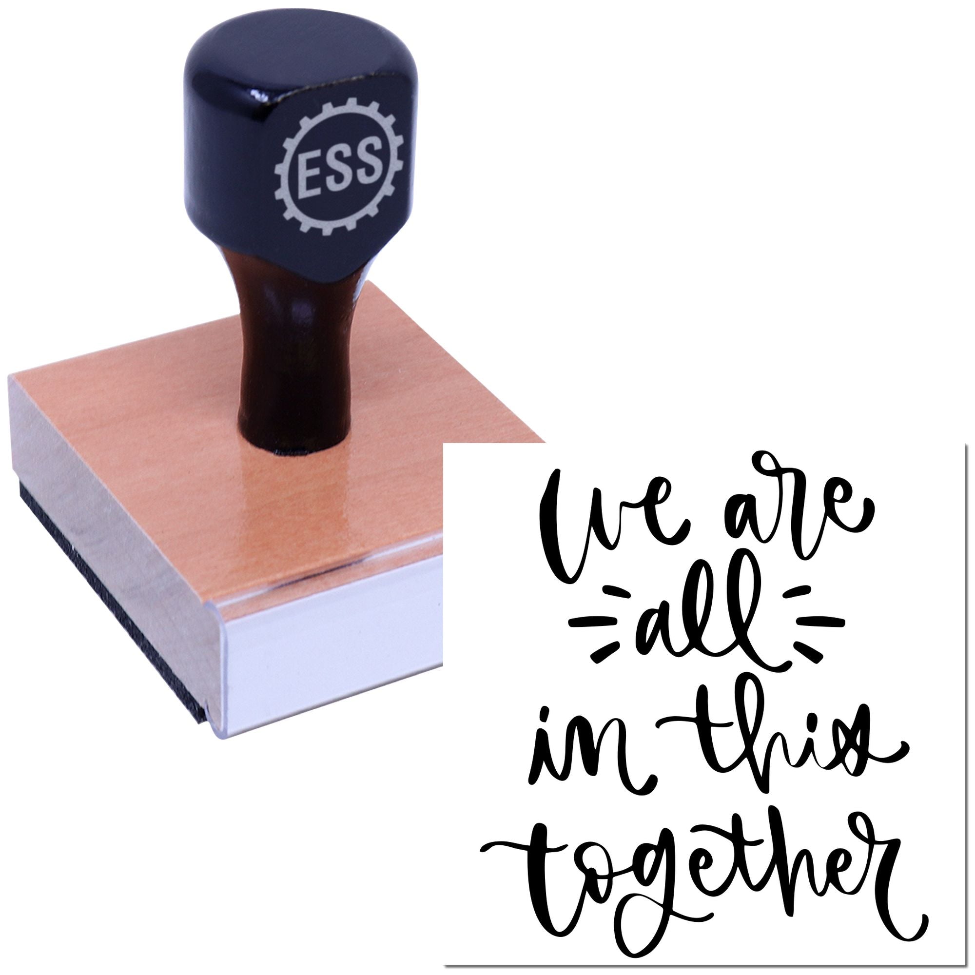 Dark blue ESS stamp and seal on a wood block beside black script text reading We are all in this together