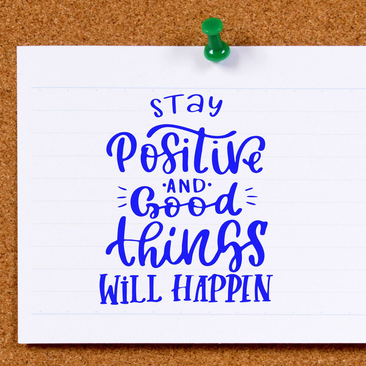 Blue motivational stamp seal on white paper, pinned with green pushpin: Stay Positive and Good Things Will Happen.