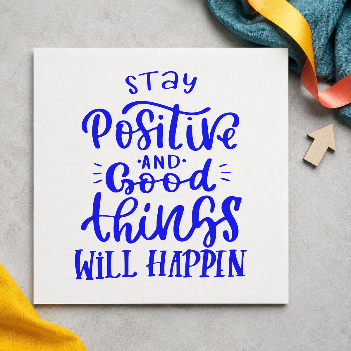 Stay Positive Good Things Happen craft stamp in blue ink on cardstock, an easy option for garden apron printing.