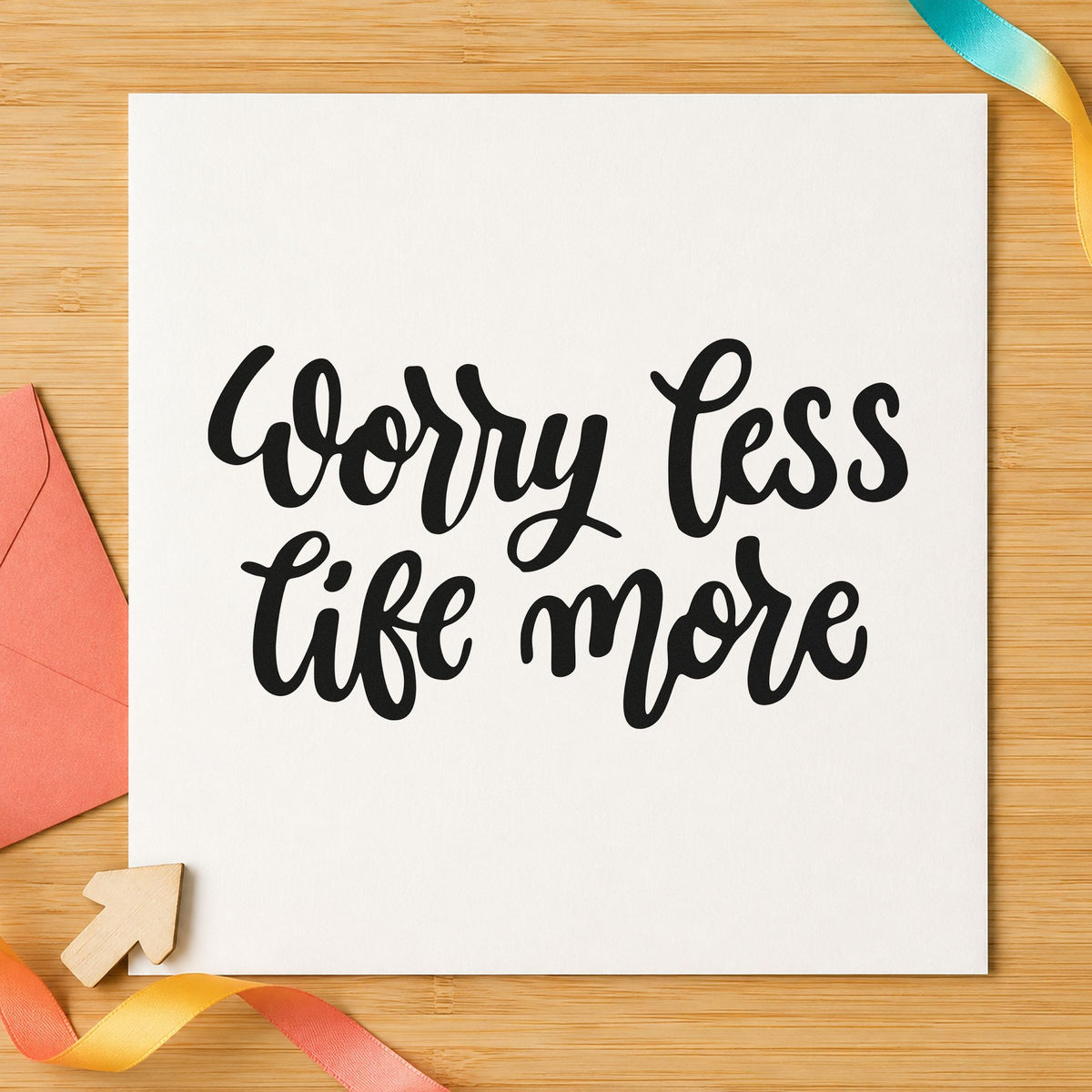 Worry Less Live More craft stamp imprint in black ink on a handmade project, one idea being bunk bag gift tags.