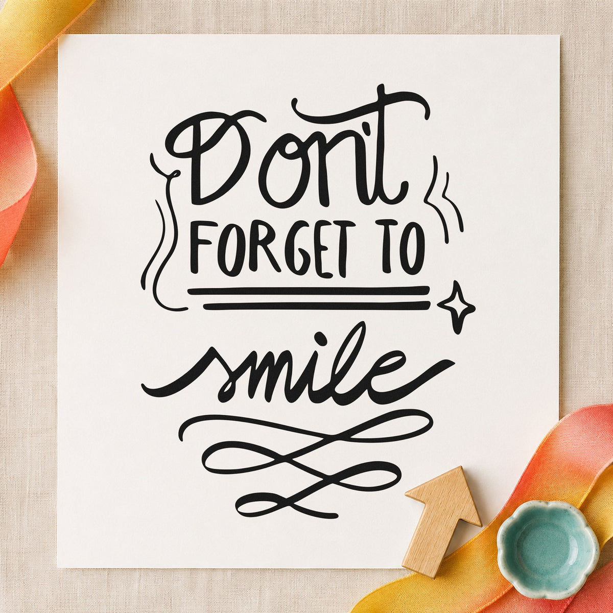 Don't Forget To Smile craft stamp imprint in black ink on a handmade project, one idea being brush kit gift tags.