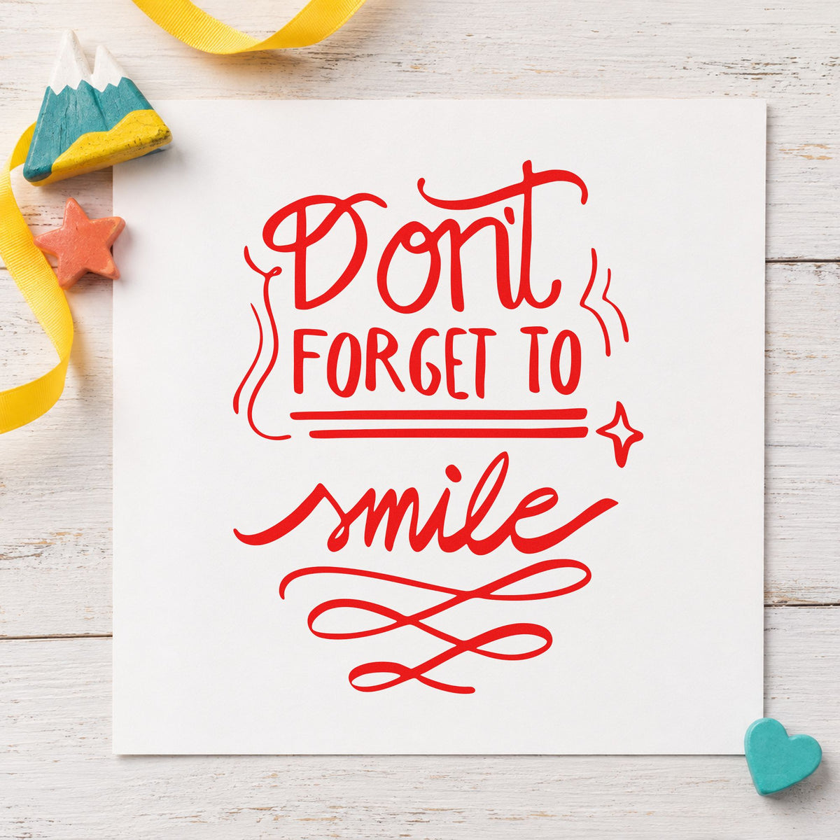 Don't Forget To Smile rubber stamp shown in red ink, stamped for projects such as drawer instrument labels.