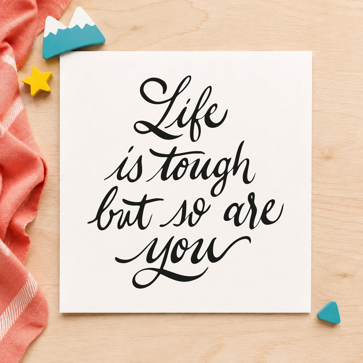 Life Tough So Are You craft stamp imprint in black ink on a handmade project, one idea being feed sack gift tags.