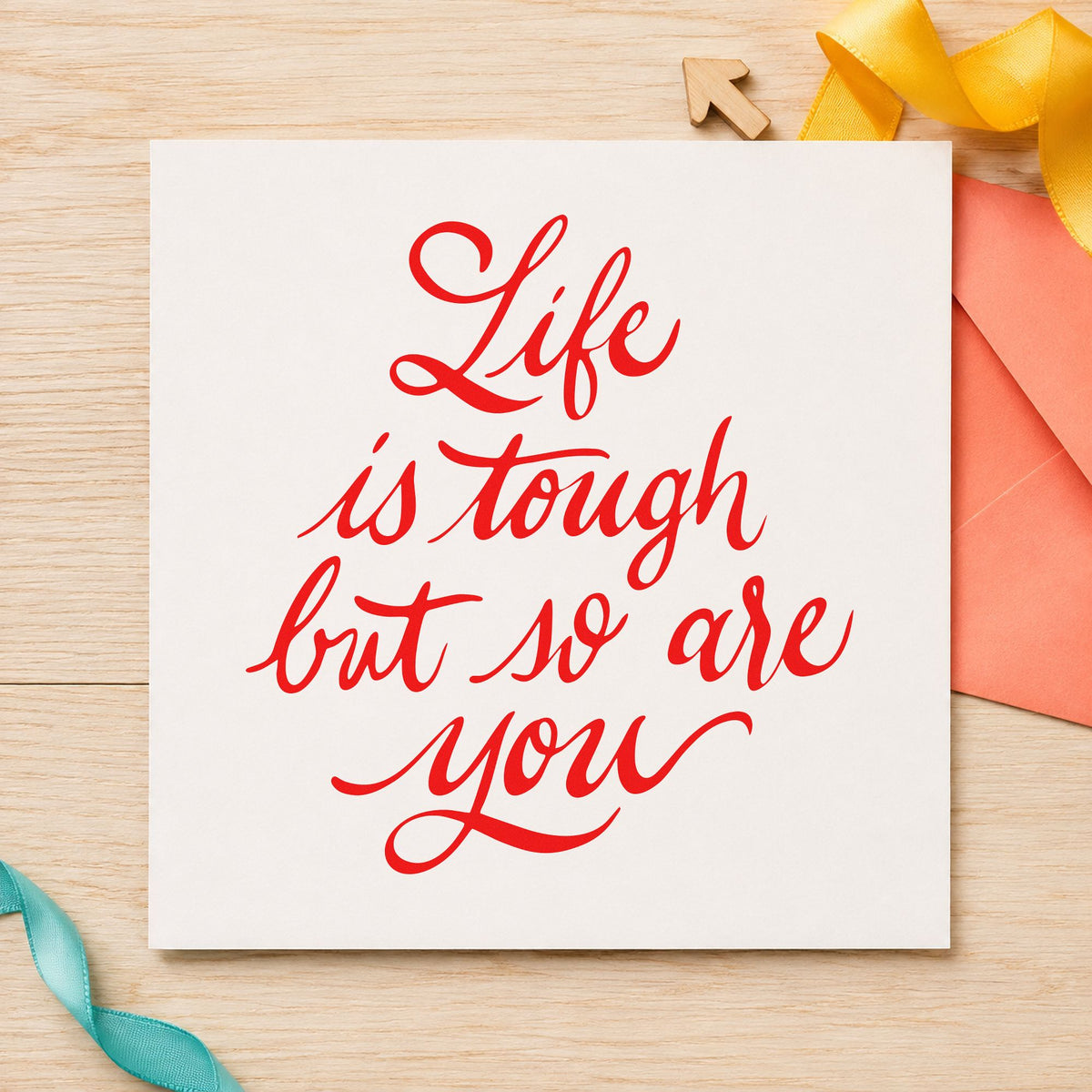 Life Tough So Are You craft stamp imprint in red ink on a handmade project, one idea being season recap cards.