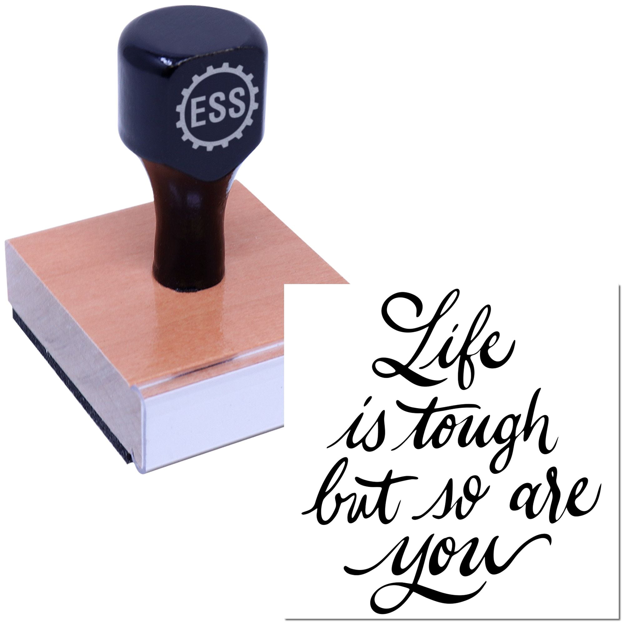 Dark navy ESS seal stamp on a pink wooden block, with cursive Life is tough but so are you design.