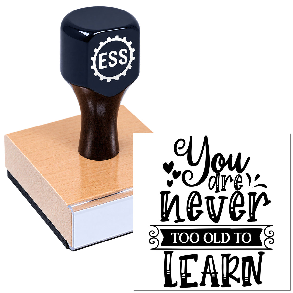 Dark blue ESS self-inking stamp on a pink wooden seal block, with black "You are never too old to learn" design.