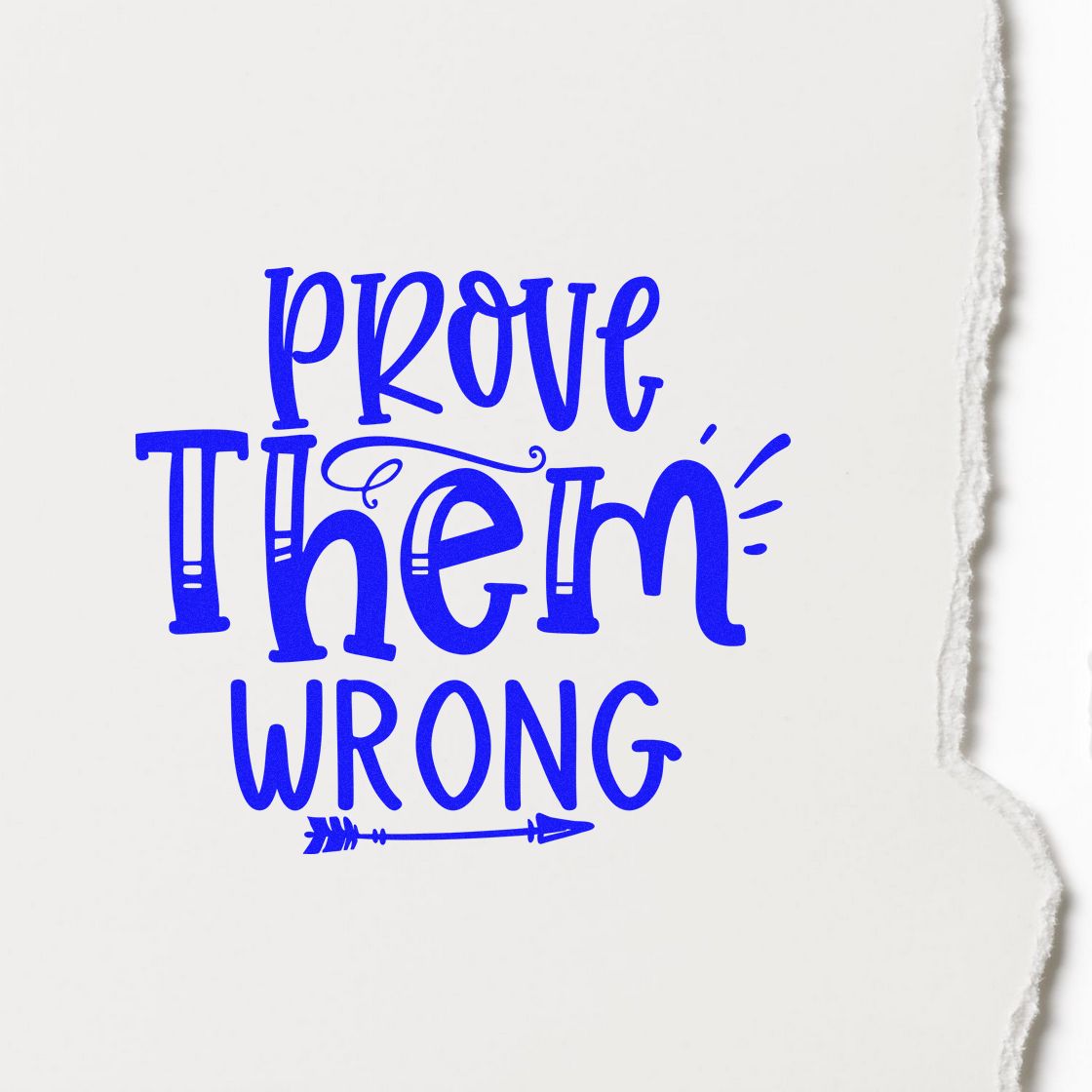 Blue custom stamp or seal reading Prove Them Wrong with arrow accents on white torn-edge paper.