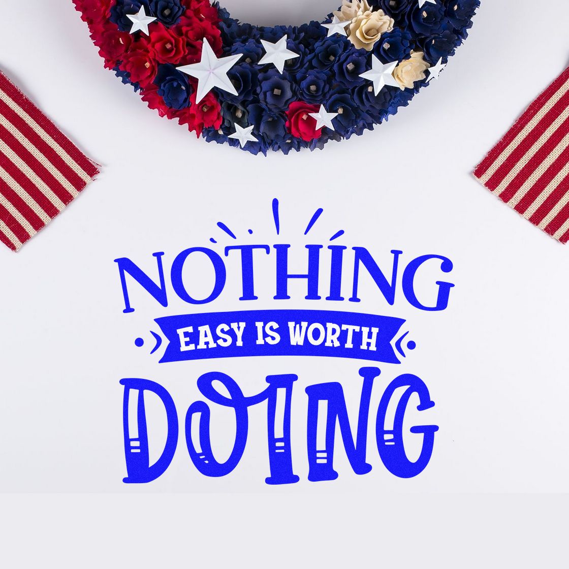 Patriotic stamp seal in blue with Nothing Easy Is Worth Doing, framed by red, white and navy floral wreath and striped corners.