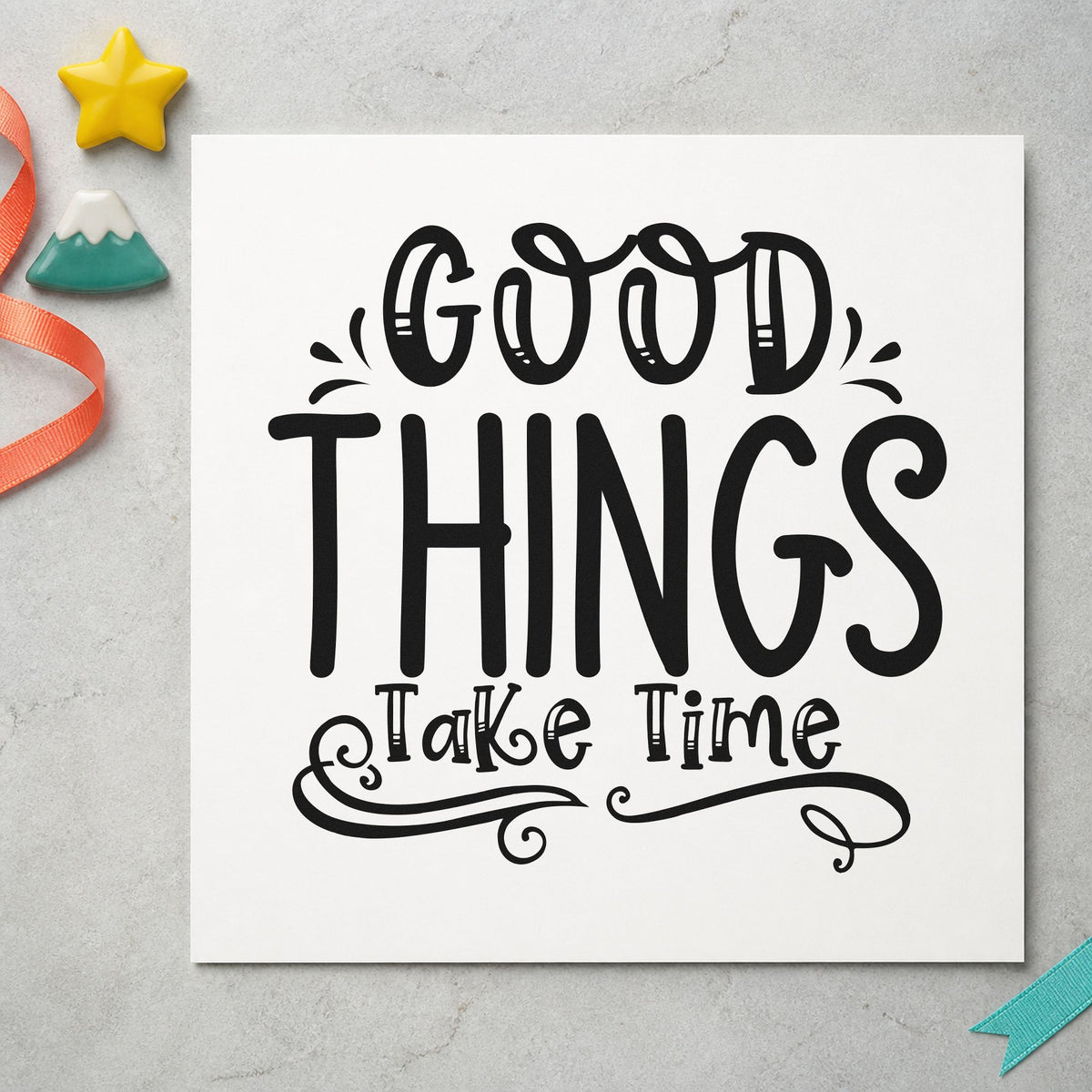 Good Things Take Time Flourishes craft stamp imprint in black ink on a handmade project, one idea being nursery pot gift tags.