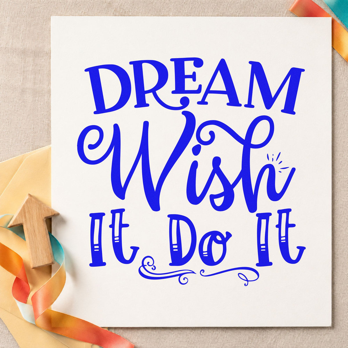 Dream Wish Do It craft stamp in blue ink on cardstock, an easy option for board backing printing.
