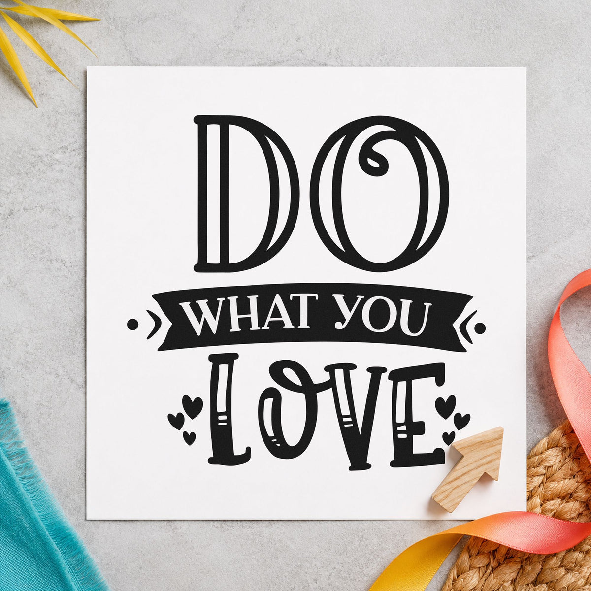 Do What You Love craft stamp imprint in black ink on a handmade project, one idea being book bundle gift tags.