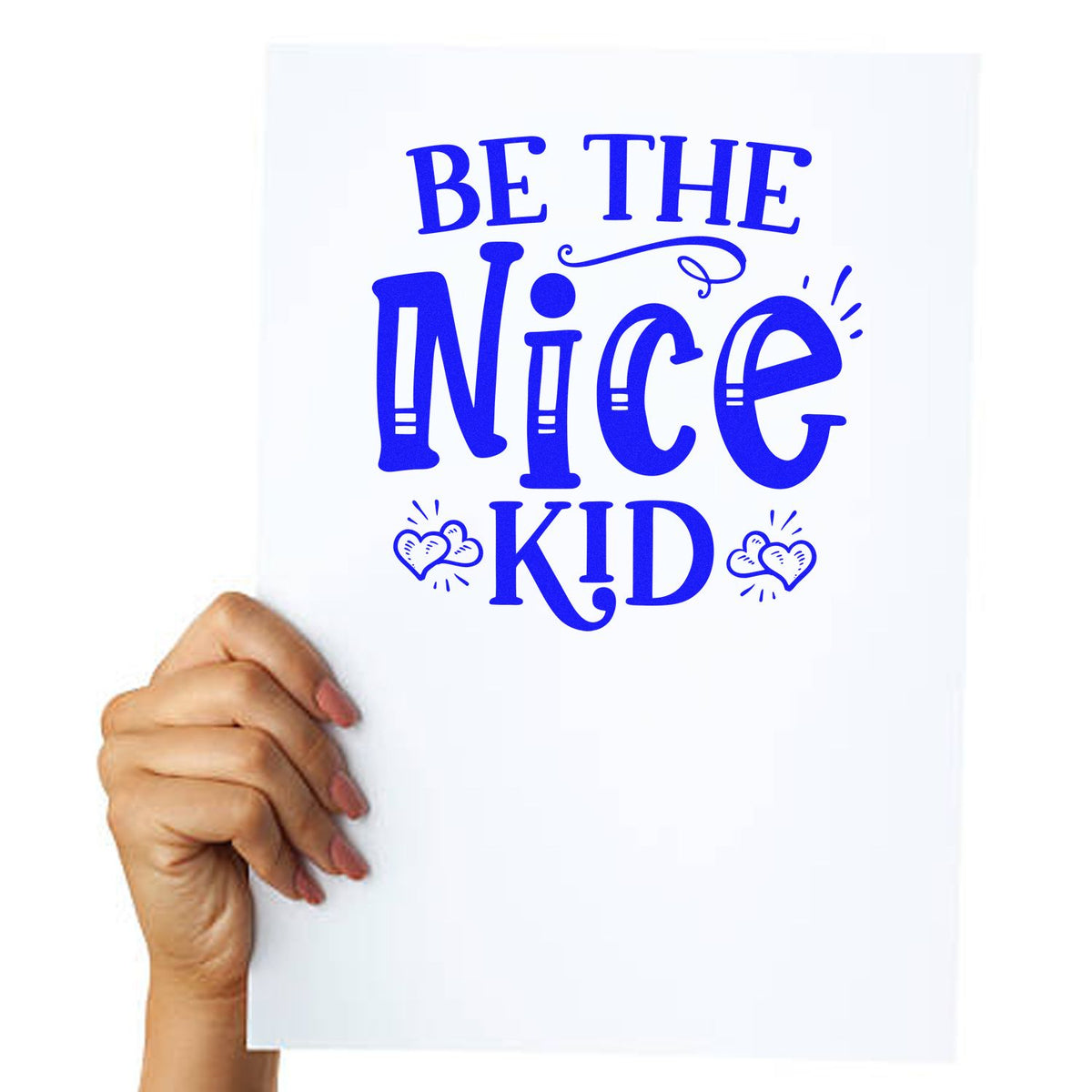 Blue stamp-style seal design reading Be the Nice Kid with heart accents on a white card held by hand.