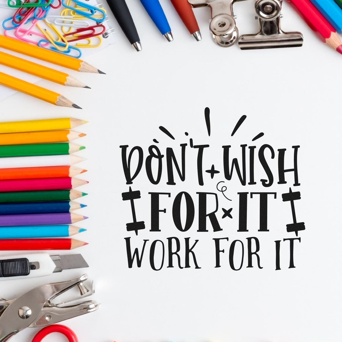Black Dont Wish for It, Work for It stamp and seal design with colorful pencils, paper clips, pens, and silver clips.