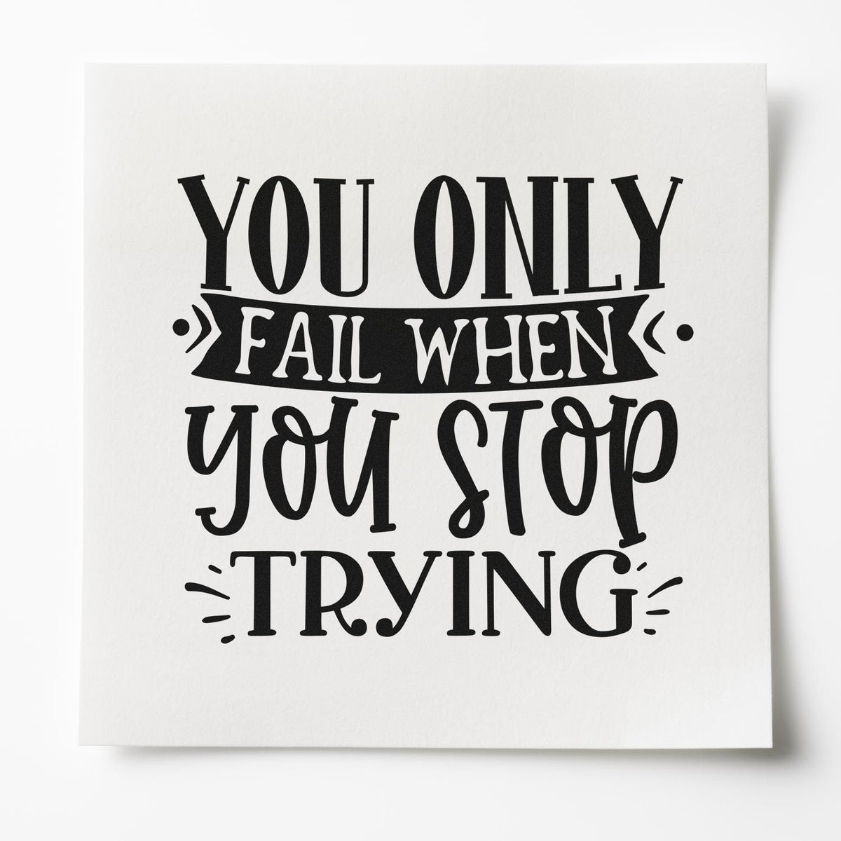 Black motivational rubber stamp design on white paper with bold text: You only fail when you stop trying.
