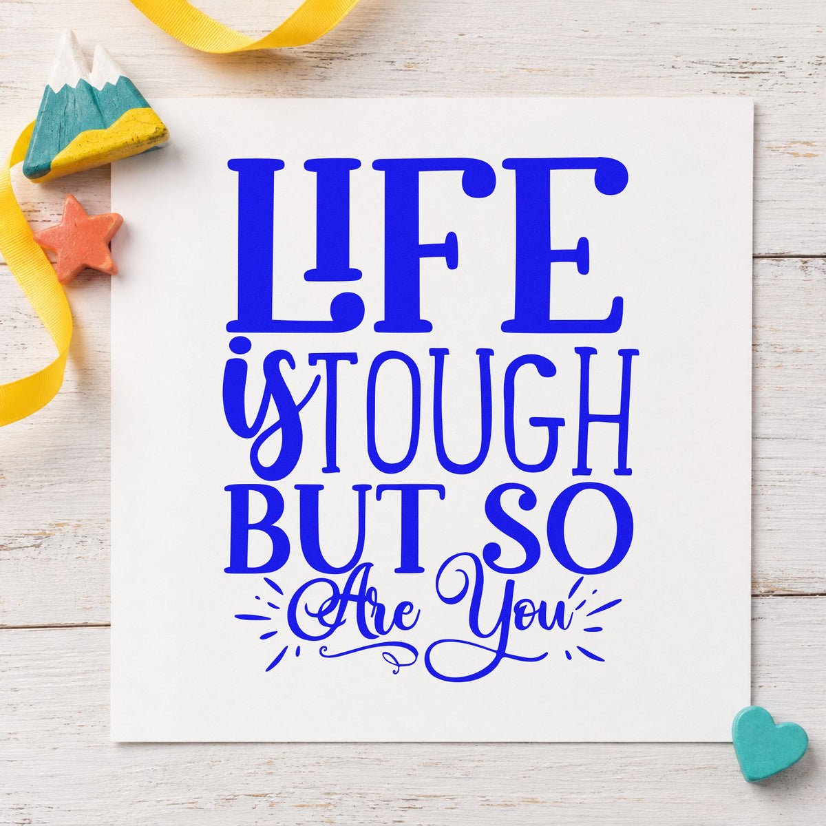 Life Tough But So You craft stamp imprinted in blue ink on paper, a design suited to framed locker row.