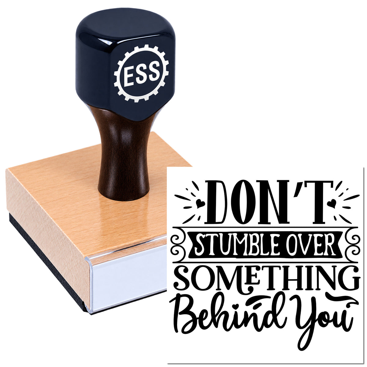 Black ESS self-inking stamp on pink seal block with "Don't stumble over something behind you" text design.